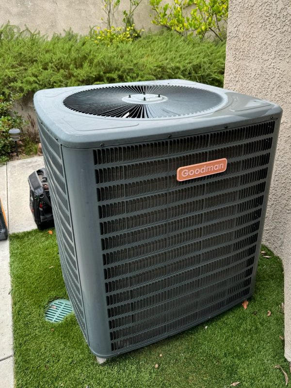 Old air conditioning unit before replacement